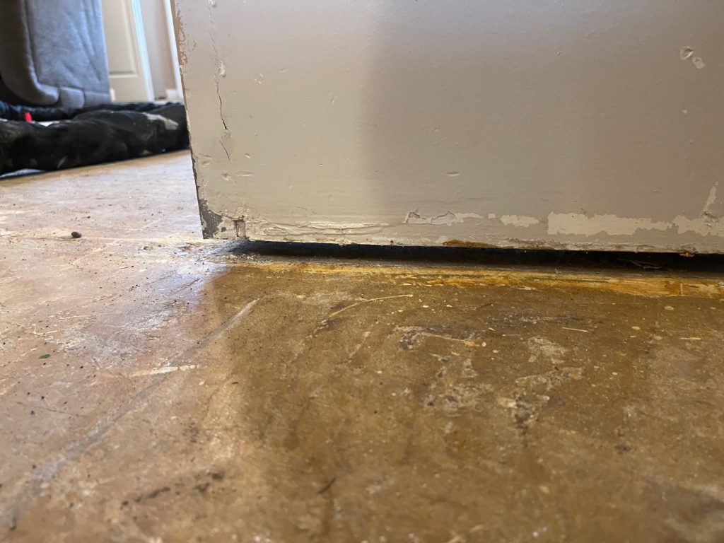 sloping floors causing gap under wall 