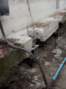 Push Piers attached to home foundation repair 