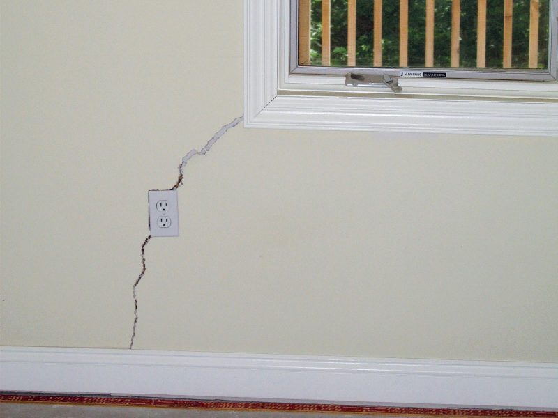 crack in drywall by corner of window