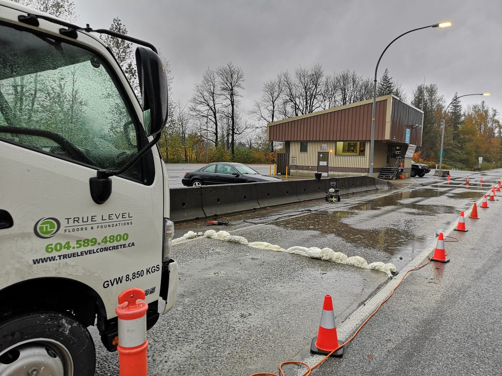 True Level truck and traffic cones for concrete lifting