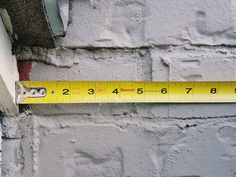 Measuring tape against the wall