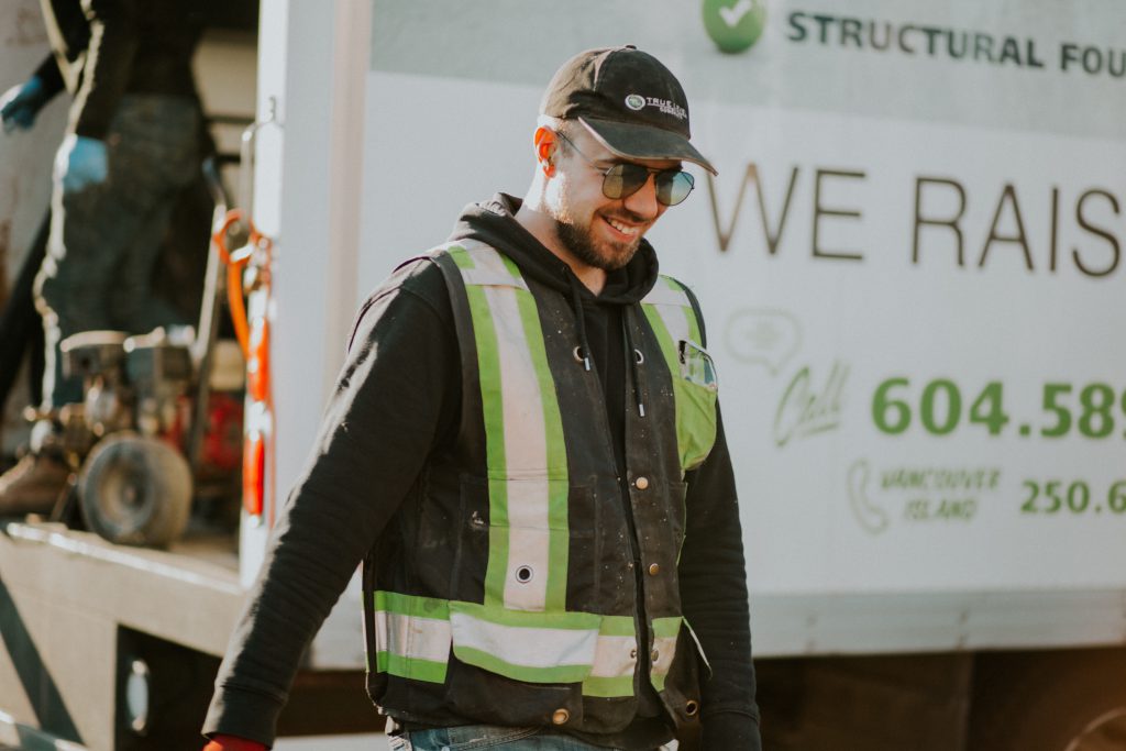 Staff smiling during concrete lifting