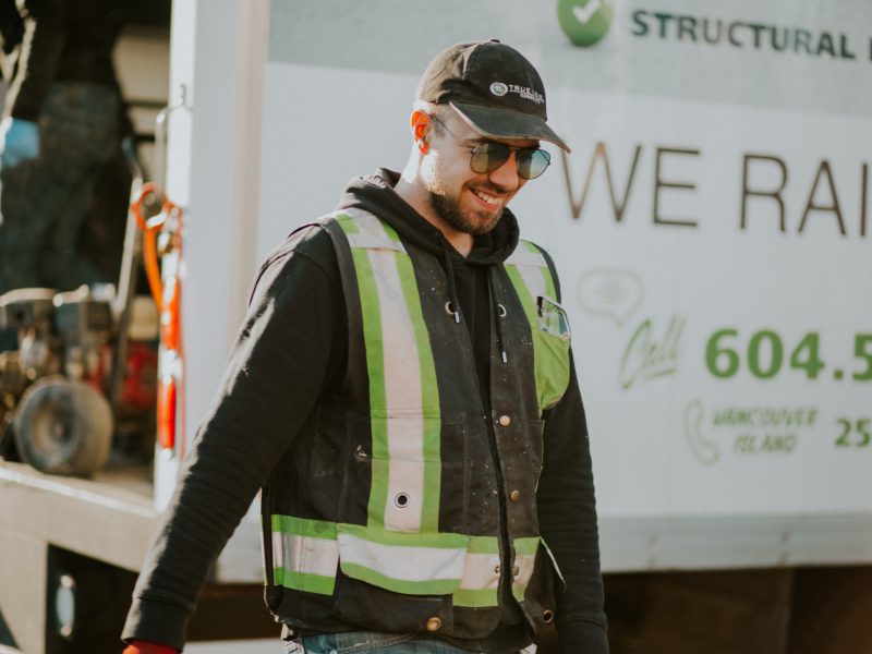 Staff smiling during concrete lifting