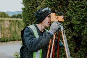 True level staff looking through a lens