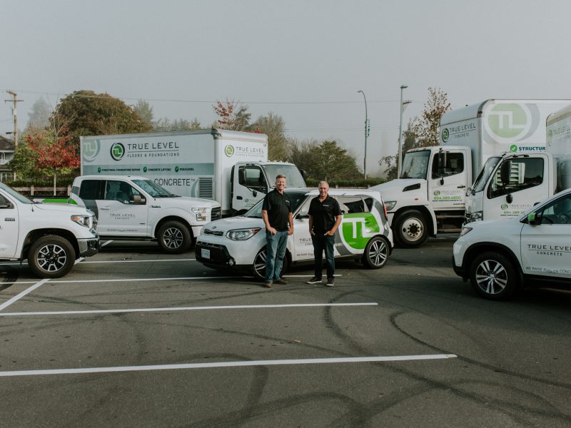 True Level staff with company service trucks