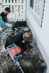 Employee wearing a protective mask during repair