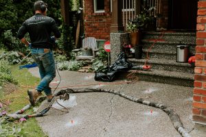 Employee concrete repair in action