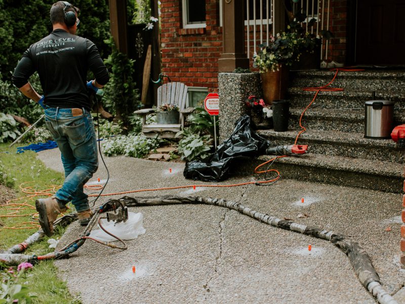 Employee concrete repair in action