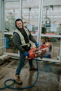 Employee repairing foundation for Gardenworks