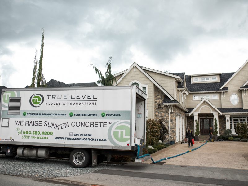 True level concrete truck outside a house