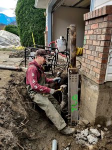 Man fixing foundation - Chilliwack Sunken Foundation - True Level Concrete