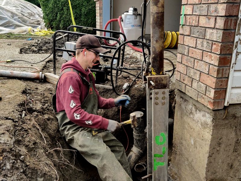 Man fixing foundation - Chilliwack Sunken Foundation - True Level Concrete