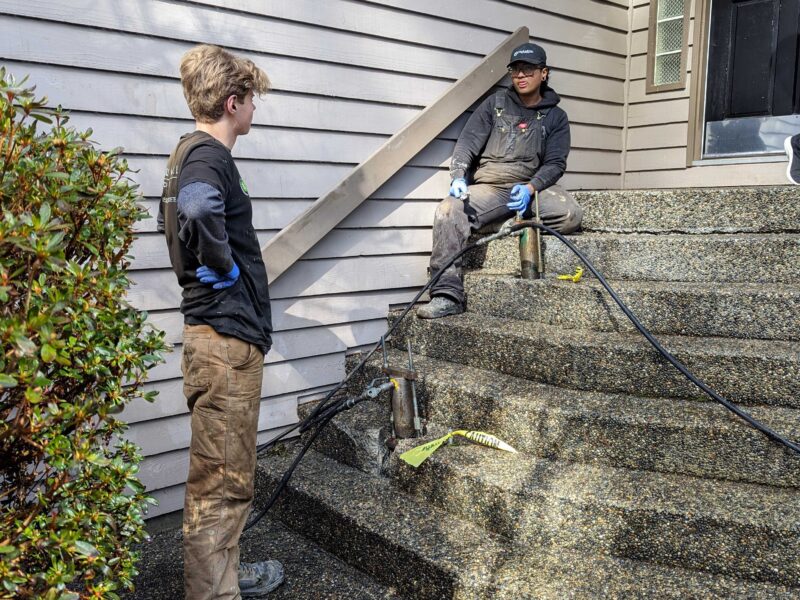 crew repairing concrete steps