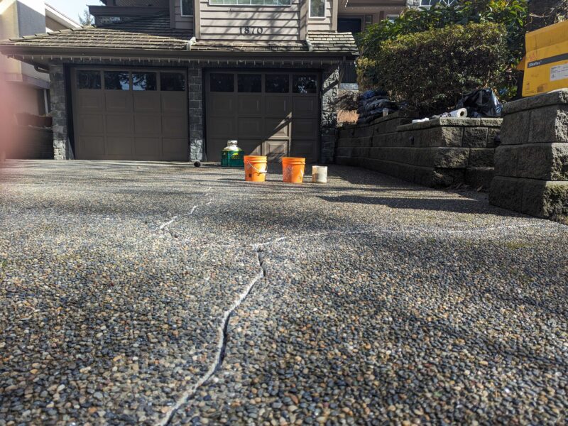 driveway with closeup of cracks