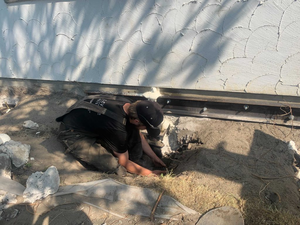 Crew man working on a home foundation