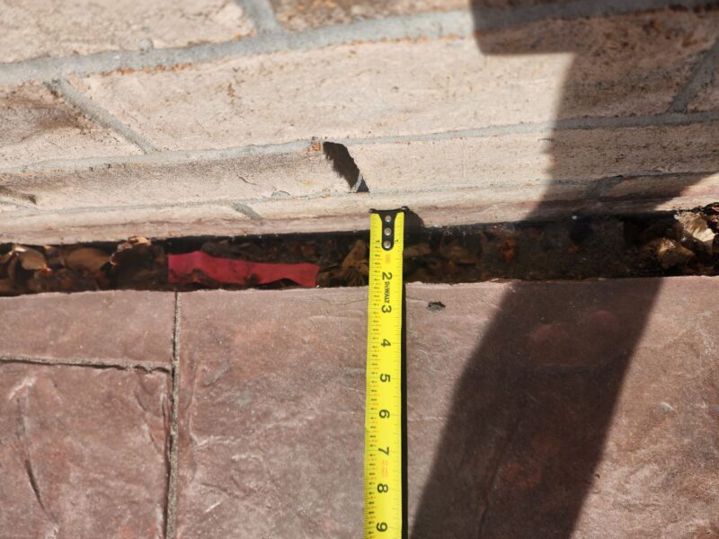 Close up of a gap between the home and patio