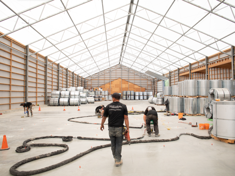 our team in a metal warehouse