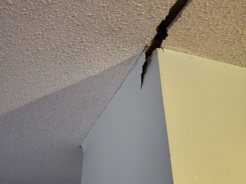 Crack in ceiling and drywall - symptoms of settlement in Richmond home