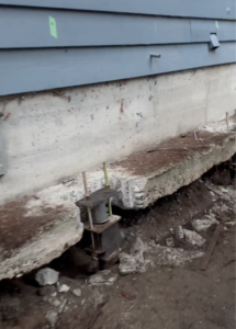 Push Piers attached to home foundation repair 