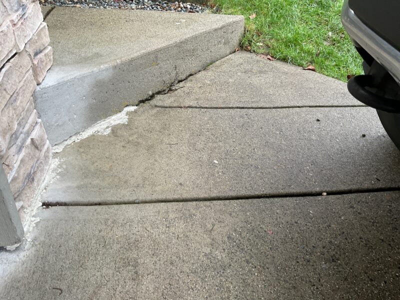 Before: Concrete steps have a cracked void that was previously filled but has continued to separate.