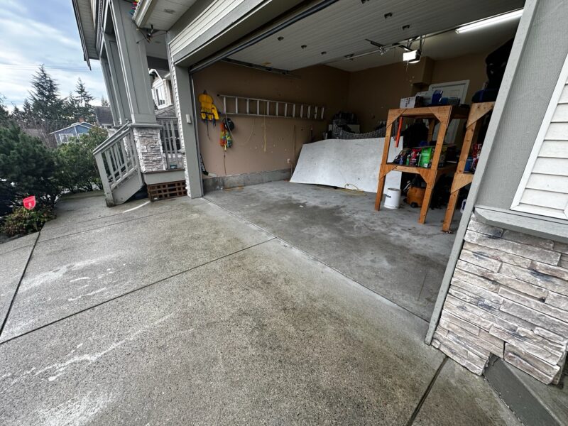 After: Driveway and garage slabs aligned and the concrete gets levelled