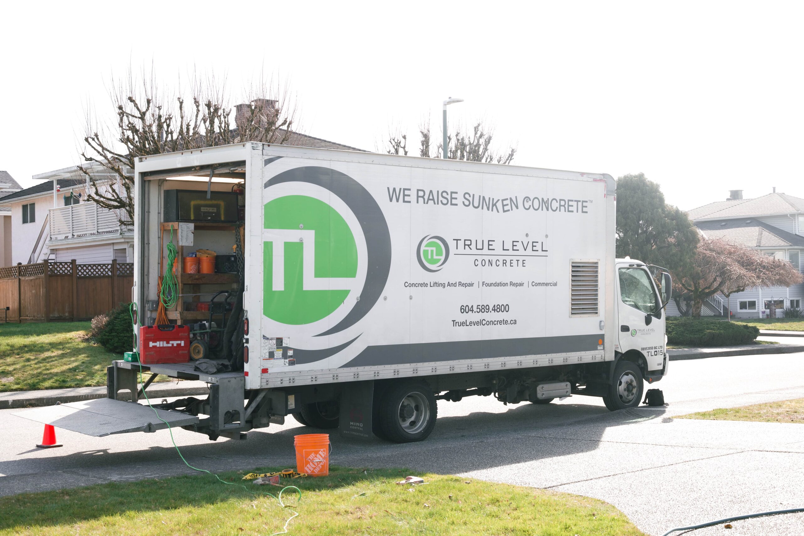 Company truck in front of driveway