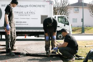 Installers working on coquitlam driveway service area