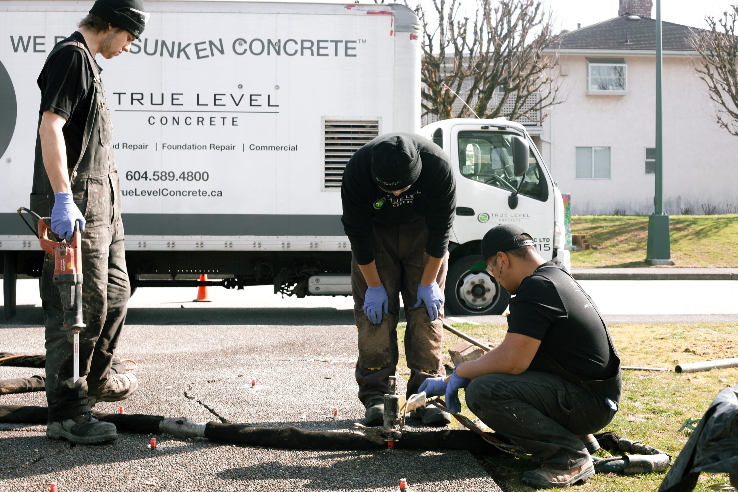 Installers working on coquitlam driveway service area