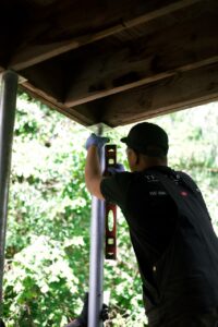 crew member levelling the piers