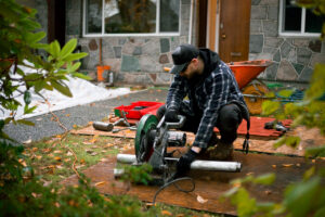 crew member cutting a steel pier