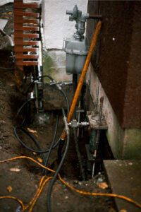 bracket on home foundation push pier