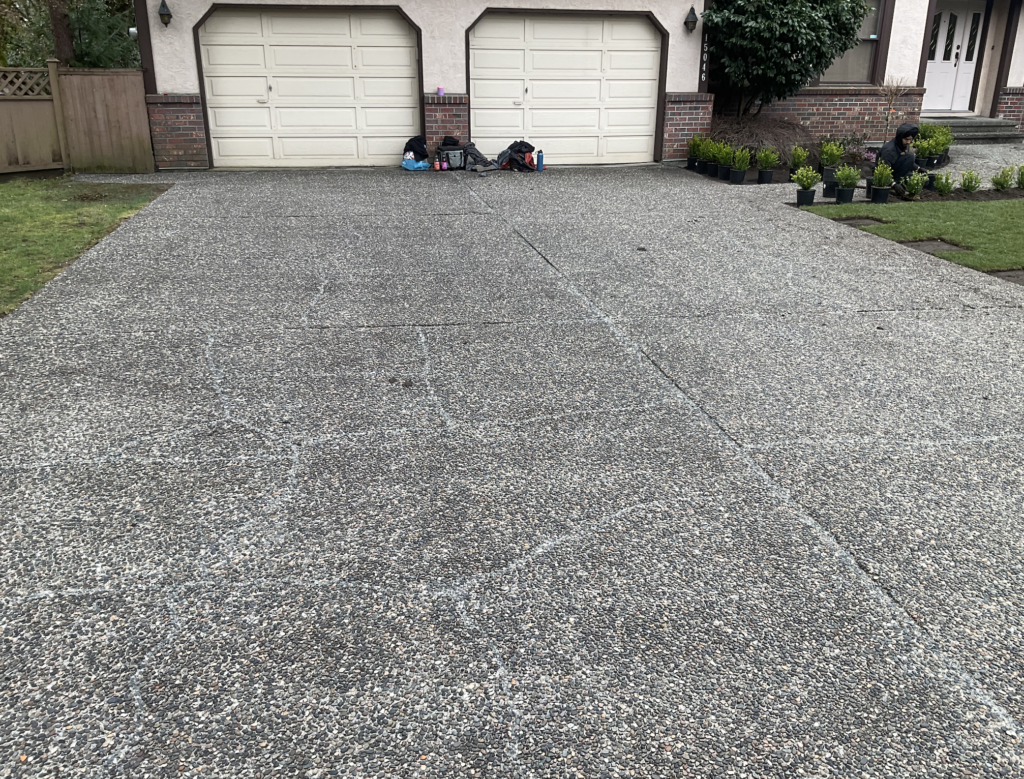 After power washing, concrete lifting with PolyLevel and crack repair. 